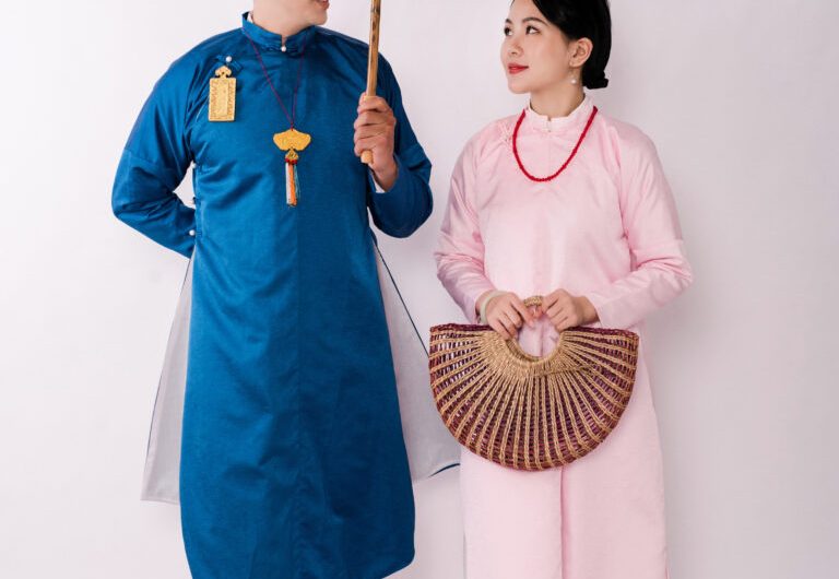 Traditional Vietnamese costumes - The bride and groom in their sleeveless Ao Dai